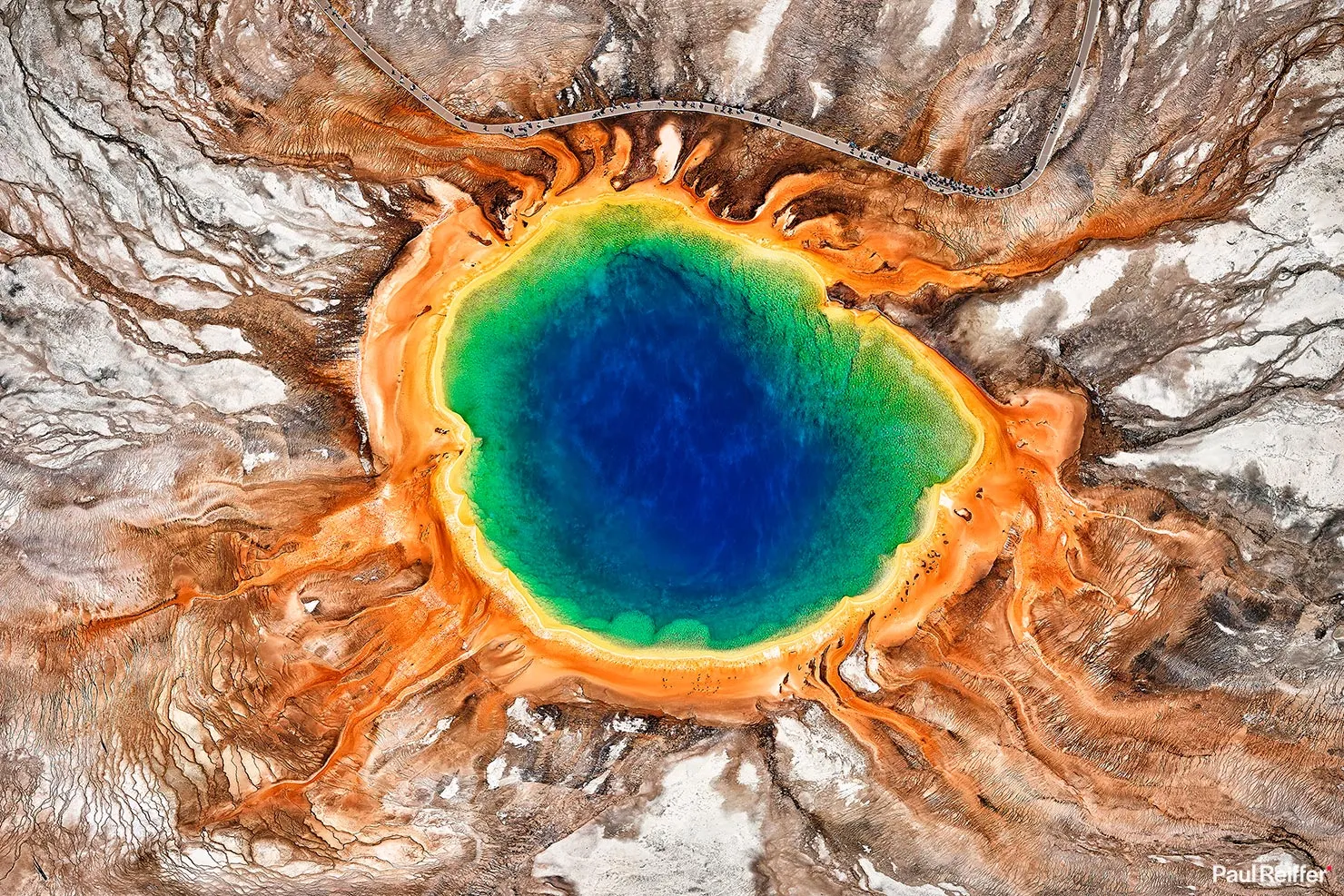 Aerial view of Grand Prismatic Spring showing vibrant colors during peak season tours