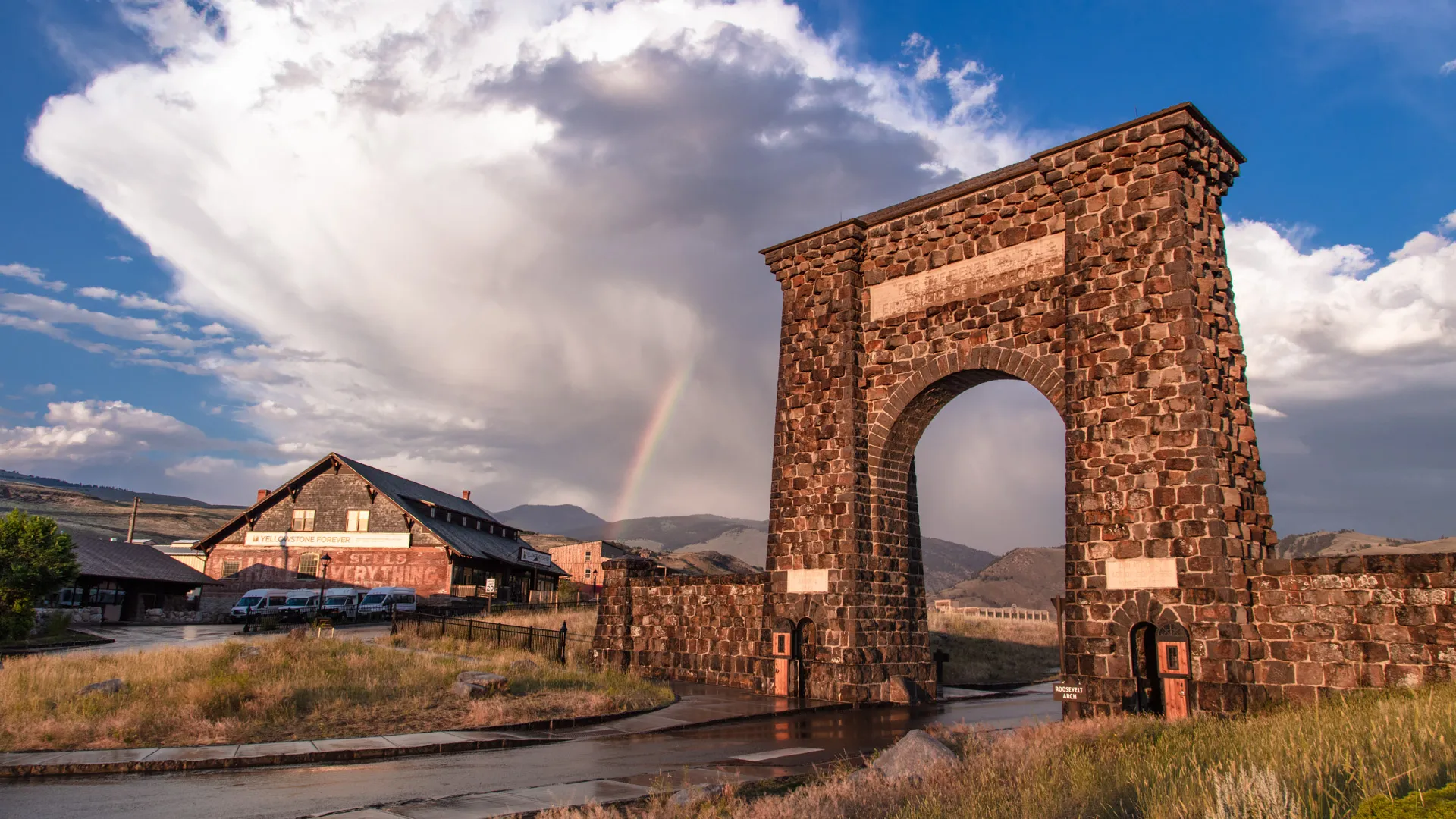 Roosevelt Arch with rainbow at Yellowstone National Park North Entrance