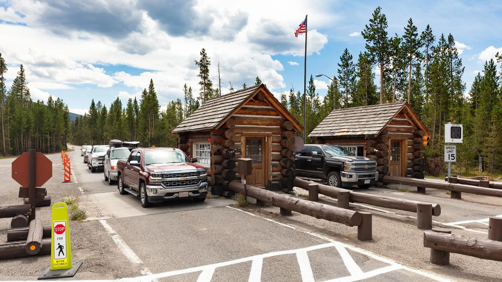 Yellowstone South Entrance Station with log cabin buildings