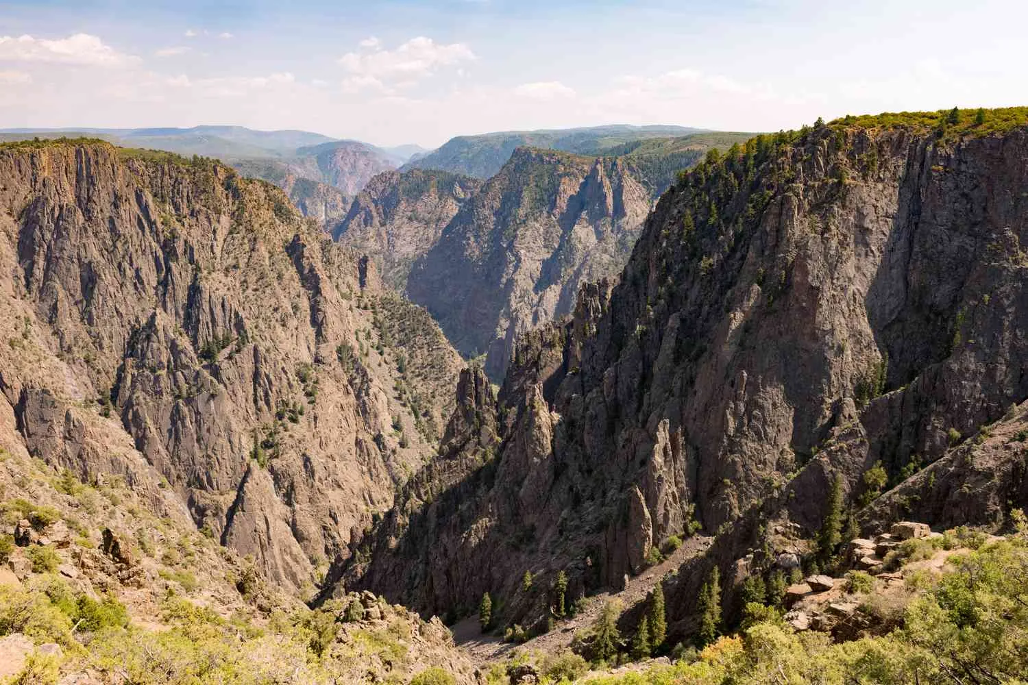 Panoramic view of Black Canyon of the Gunnison showing steep canyon walls and dramatic landscape