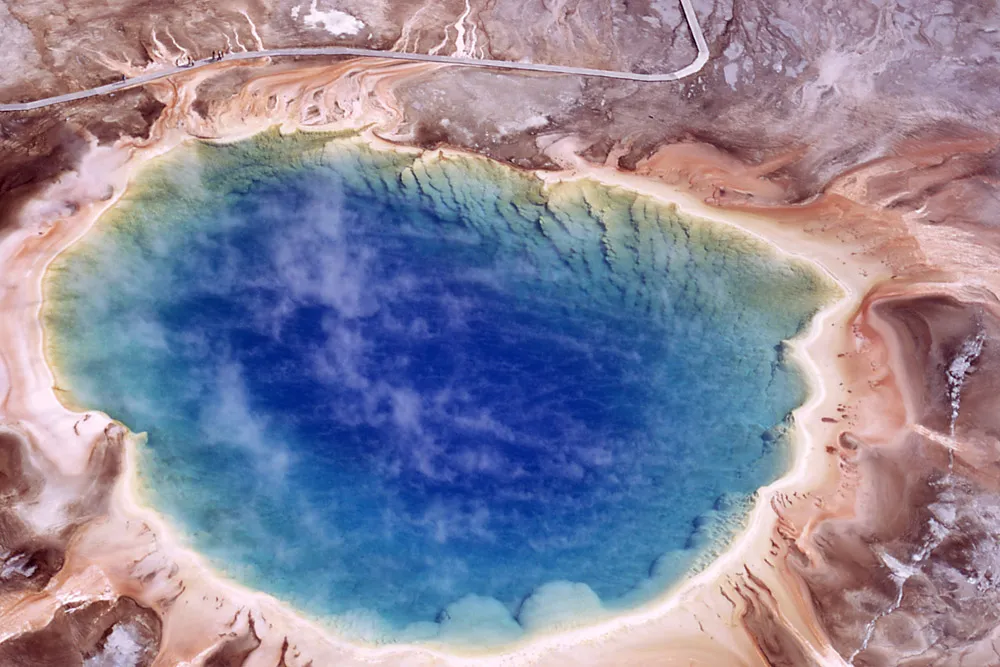 Aerial view of colorful Yellowstone National Park hot springs showing rainbow-colored thermal pools