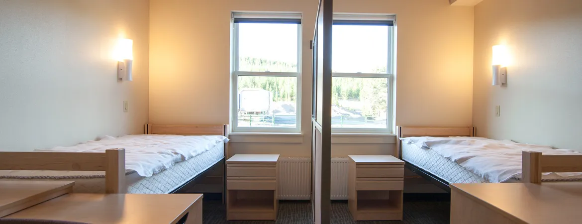 Yellowstone Old Faithful employee dormitory exterior showing mountain landscape