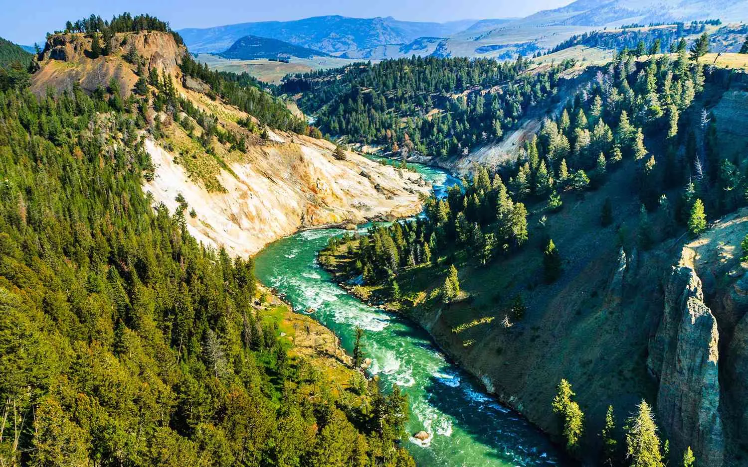 Yellowstone National Park summer landscape showing diverse terrain and weather conditions across different elevations
